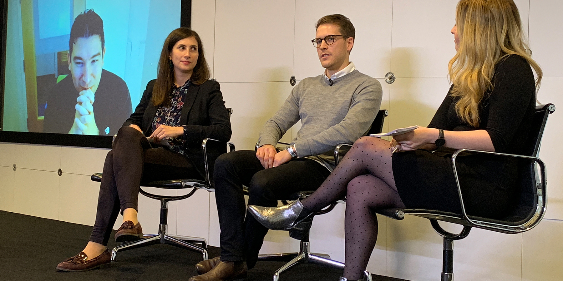 Olga is sitting in the chair and participating in the panel discussion